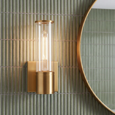 Lea Wall Sconce, Aged Brass geometric wall sconce in a Contemporary Bathroom with green kit-kat tile and a round brass mirror.