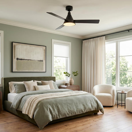 A transitional bedroom with the Monroe LED Ceiling Fan 54", Matte Black in the ceiling center above a sage green bed and white floor-to-ceiling curtains.