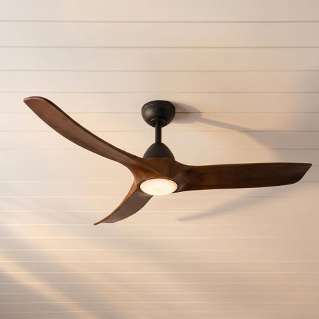 A modern living room featuring the Sedona LED Ceiling Fan 60" in matte black and dark walnut installed in the center of a white shiplap ceiling.