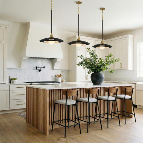 A contemporary kitchen features three Yates LED Pendant 18", Matte Black and brushed brass pendants over a wood slat island with white marble countertops.