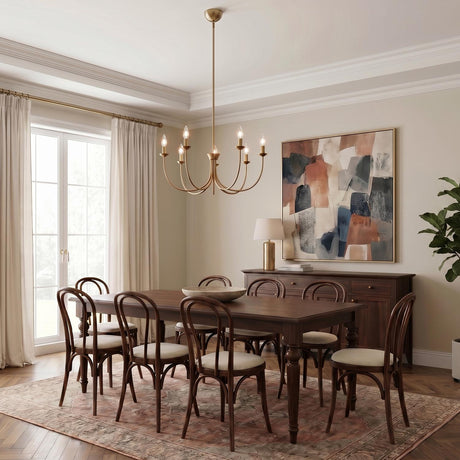A transitional dining room with a brushed brass Channing 7 Light Chandelier 26" suspended over a dark wood table with Thonet-style chairs and herringbone wood flooring.