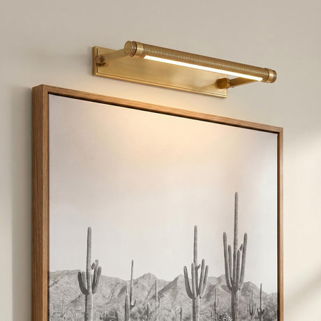 A transitional living room with the Heath LED Picture Light 18", Aged Brass in an aged brass finish mounted above a framed desert landscape painting.