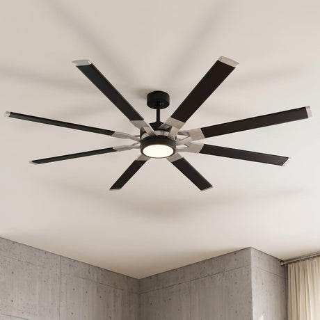A modern living room with a Loon LED Ceiling Fan 72 inch in matte black and brushed steel finish mounted to the ceiling center above industrial concrete walls.