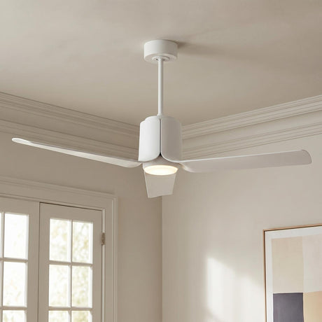 A transitional living room featuring the matte white Condor LED Ceiling Fan 52" with a frosted glass diffuser installed at the ceiling center near white crown molding.