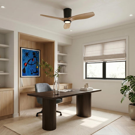 A modern office with the Avocet LED Ceiling Fan 44", Matte Black and Natural Oak mounted centrally over a dark wood desk and herringbone floors.