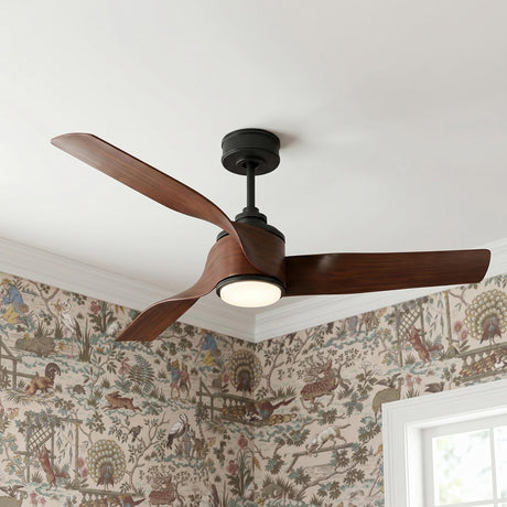 A transitional bedroom with a Merlin LED Ceiling Fan 60", Walnut and Matte Black along the ceiling center above botanical animal-patterned wallpaper and white crown molding.