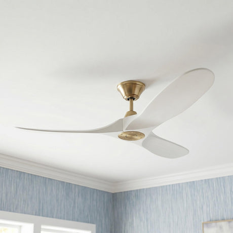 A contemporary bedroom with an Egret Ceiling Fan featuring matte white oak blades and modern brass hardware installed on the ceiling with blue grasscloth wallpaper and crown molding.