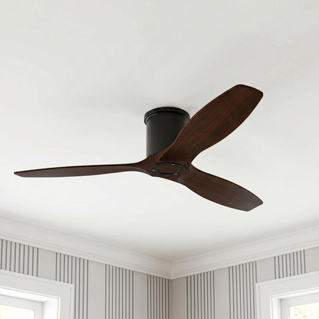 A transitional bedroom featuring the Harrier Smart Ceiling Fan 52" in walnut wood and matte black mounted to a white ceiling above gray striped wallpaper.