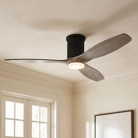 A contemporary living room featuring the Harrier LED Smart Ceiling Fan with gray wash oak blades and aged pewter finish installed along a standard ceiling with crown molding.