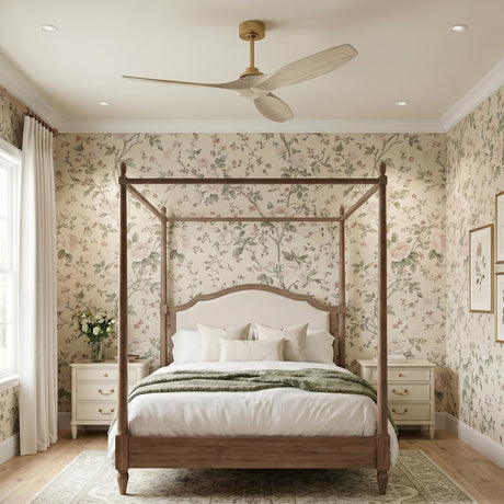 A traditional bedroom with the Heron Smart Ceiling Fan 60", Whitewash Oak and Modern Brass, mounted over a wood four-poster bed and floral wallpaper.