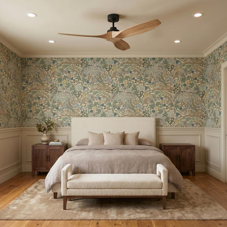 A transitional bedroom with a Heron Smart Ceiling Fan 60" in natural oak and matte black mounted on the ceiling center above floral wallpaper and wainscoting.