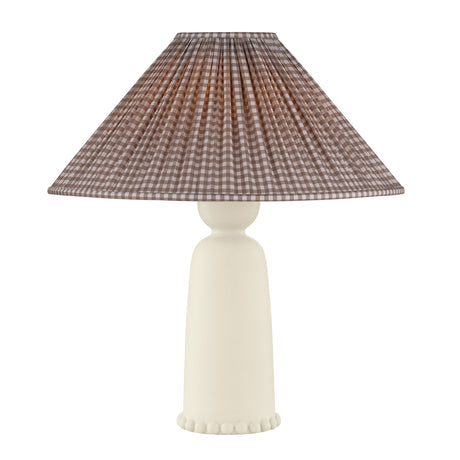 Bonnie table lamp with a pleated conical shade in a brown and beige gingham pattern, mounted on a smooth, tapered off-white ceramic base with a scalloped edge.